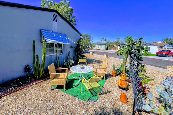 bistro table & chairs under lights for evening al fresco dining - Fully Furnished 2 Bedroom Home in safe, family neighborhood