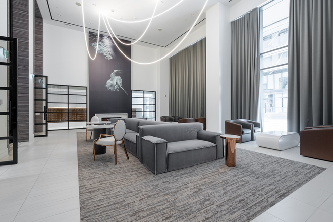 Lobby lounge - Furnished 1-Bedroom + Large Den/2-Bath Condo with Direct Subway Access at Yonge & Eglinton