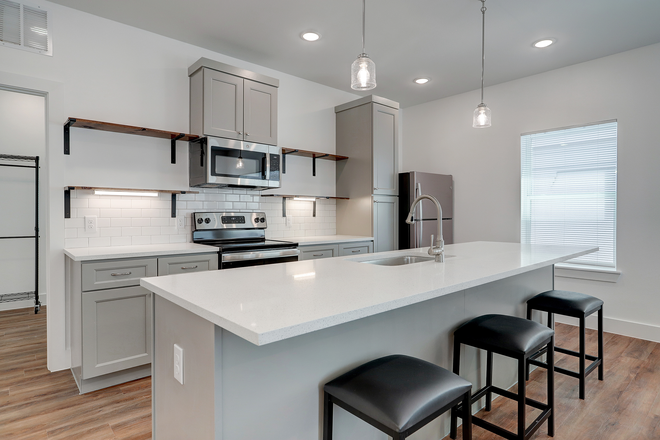 Kitchen - Bedrooms in New 3 BD/2 BA Units Available Duplex