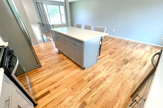 Huge breakfast island - ENORMOUS MASTER SUITES! STUNNING KITCHEN, BATHS, NEW HARDWOODS, FREE PARKING! AVAILABLE AUG 1, 2026 House