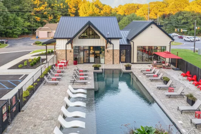 A photo of the leasing office, where the pool and fitness center are located. There is also a pool table and board games inside. - Hillside Commons Apartments