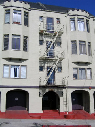 Building - This simple, comfortable studio is in a great location just a block from campus on the northwest end Apartments
