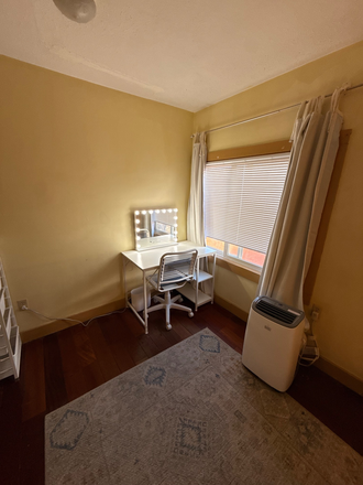 desk, A/C unit, rug - Furnished room for rent on 10th Street- Immediate move-in available!