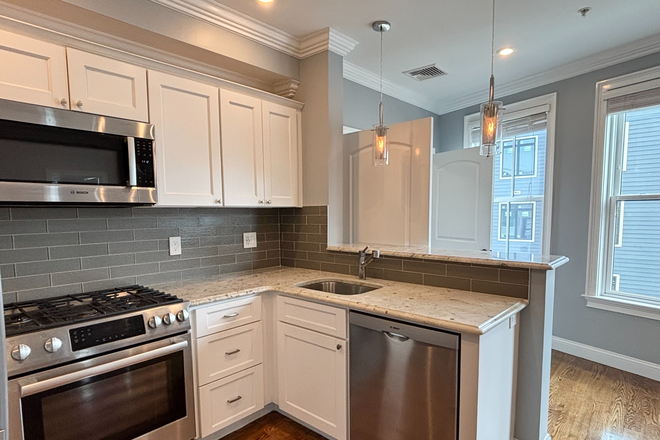 kitchen - Modern Forest Hills 2 bed + office with AC, deck, and in unit laundry - NO FEE! Apartments