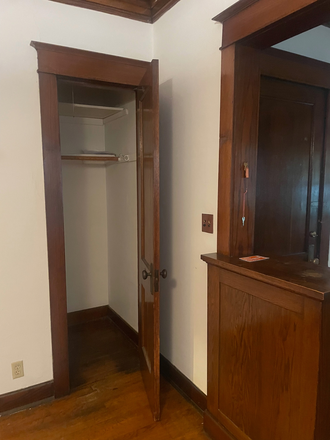 Closet - The warm wood and built-ins make this a home. A vibrant community close a Bus make it fun.