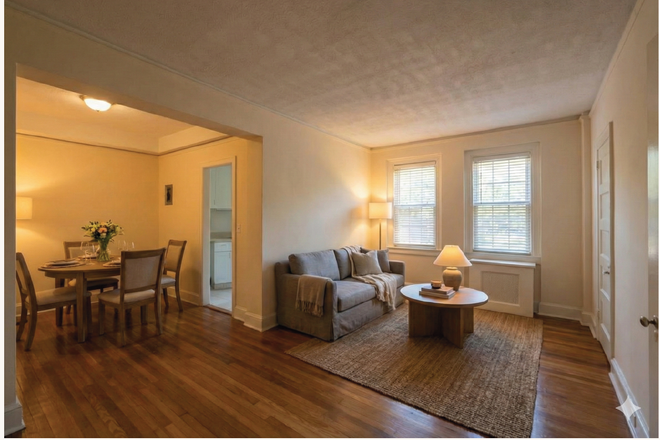 Actual Room photo. Living room and dining room (furniture not included). - Wyman Park Apartments