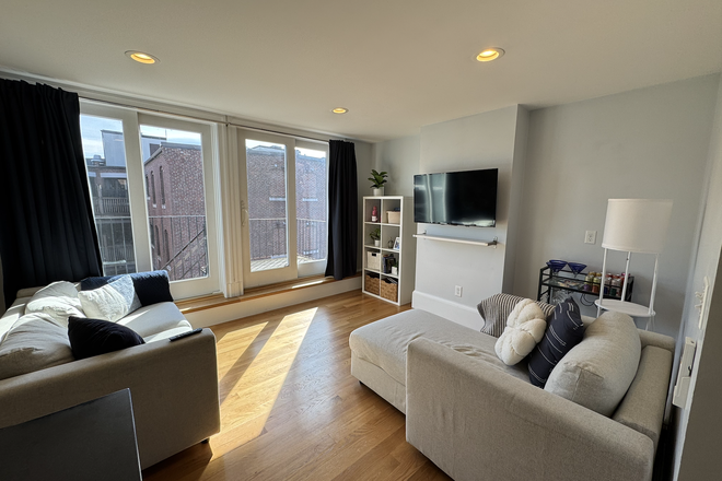 Living room (and balcony) - Sublet room in a 3 bedroom/2 bathroom apartment (June-August), female only, 5 min from campus!