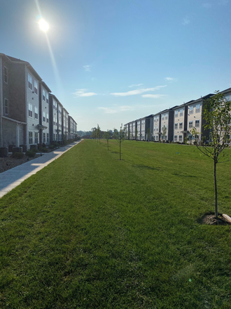 Courtyard with Grills! - The Landings at Notre Dame ~ Preferred Housing for Married and/or Parenting Students Apartments