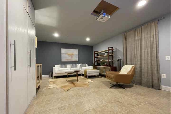 Home Theatre with LARGE MOVIE THEATRE STYLE PROJECTOR! BIG SCREEN! Great for streaming movies, sports games, and more! - NEW Lux NYC 2BR/3BA Condo! Media Room+ Huge Luxury Private YARD!