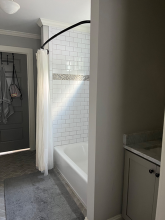 Another shot of the bathroom, which has tub with shower - Inviting Bedroom and Bath in East Lake House