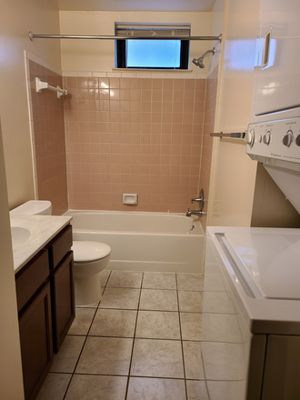 Bathroom with stacked washer and dryer - 335 ELM ST NW, Washington, DC, Apt # 2, approximately 2 city blocks from campus.