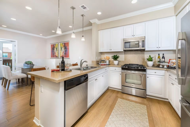 Kitchens feature granite countertops - Fully Furnished Cozy 2B2B Apartment Near UCI – Perfect for Students