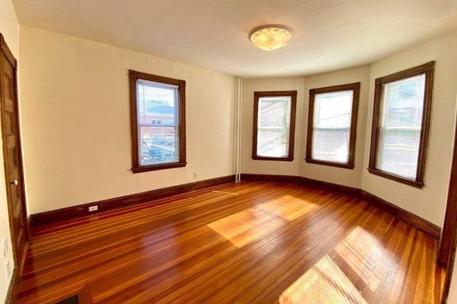 Living Room - September 1! Awesome 3 bed/2 bath on Calumet right next to the T! Apartments