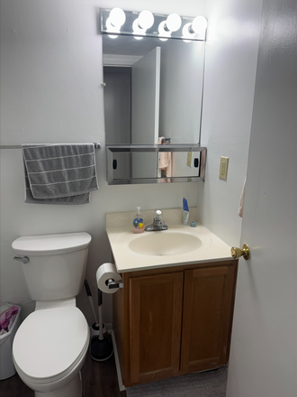 Full bath in hallway - Foxridge Apartment close to bus stop and laundry room.