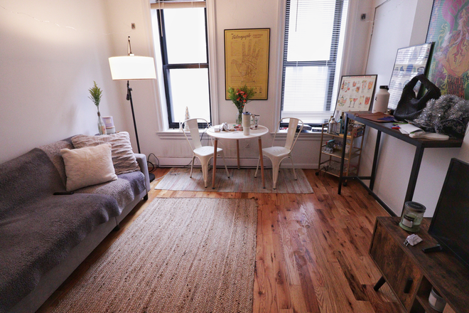 Living Room - Bright & Stylish 1-Bedroom in the Heart of Bay Village Apartments