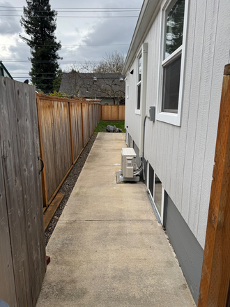 Entry through gate (with motion detecting light) - Private 2 bedroom 1 bath recently remodeled unit with fenced backyard Duplex