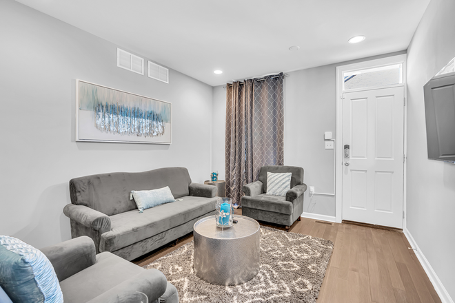 Living room - additional view - Cozy-chic furnished home walking distance to Johns Hopkins, with private parking!