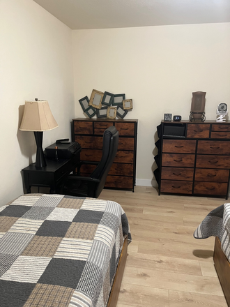 Second bedroom shared room, two twin beds, desk with printer, fan and drawers for clothes - Loving Home