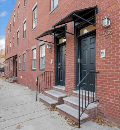 Close up view front building - Modern 3 bedroom with 3 baths and tons of amenities-gym, game room, lounge, and on-site parking Apartments