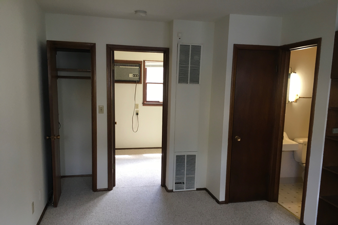 Part of living room - Nice quiet close in Study Apartment for Grad Student in residential area a few blocks from campus.
