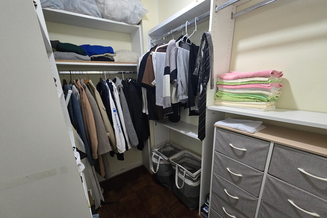 Walk-in Closet room - The President Condominium, a pleasant studio only a block away from campus