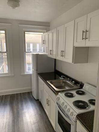 Visit hubrealtyproperties.com - Smart 2 bedroom apartment, new kitchen with dining area and a deck