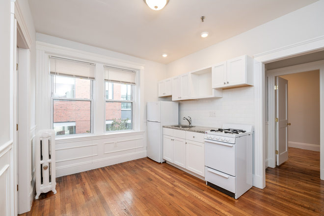 Visit hubrealtyproperties.com - Mission Hill, Sunny 2 bedroom with renovated kitchen and bathroom, free month rent