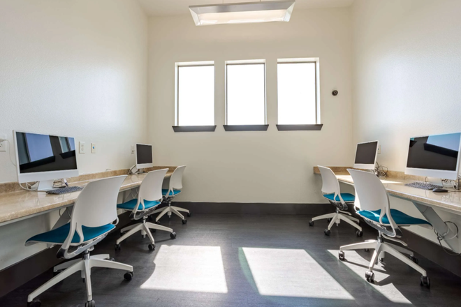 Study tables in the clubhouse with computer and internet access - Furnished 1 bedroom with private bathroom at Z islander