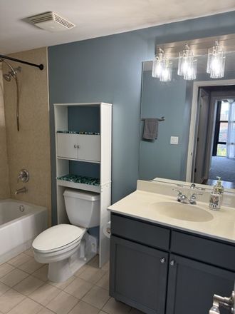 Bathroom, includes shower, toilet, shelf, sink and cabinet - Looking for 1 Roomate in 2 bed 2 bath unit with office Condo