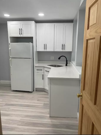 Kitchen (stove, microwave, and counter space to left) - 1460 Commonwealth Ave, 10 minute drive and 20 minute train to BC Apartments