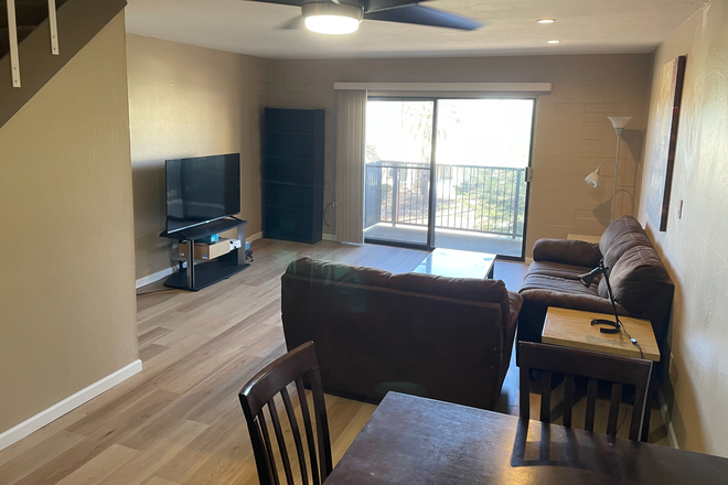 New flooring! Living room area - Campus Walk Condominiums