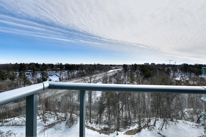 Balcony south west view over looking the ravine and pool - Brand New!!! 1 Bed  Plus Den and 2 Full Baths includes Parking Ideal for 2 Occupants