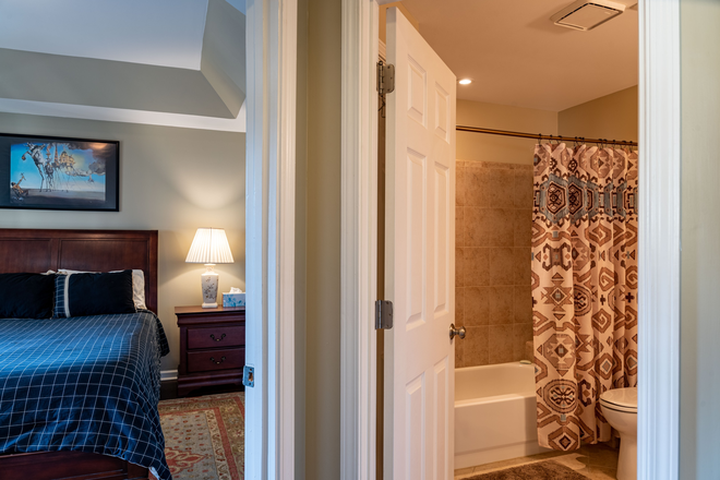 Bedroom and bath - Spacious two-story home (1459 sqft total) with double floor-to-ceiling windows.