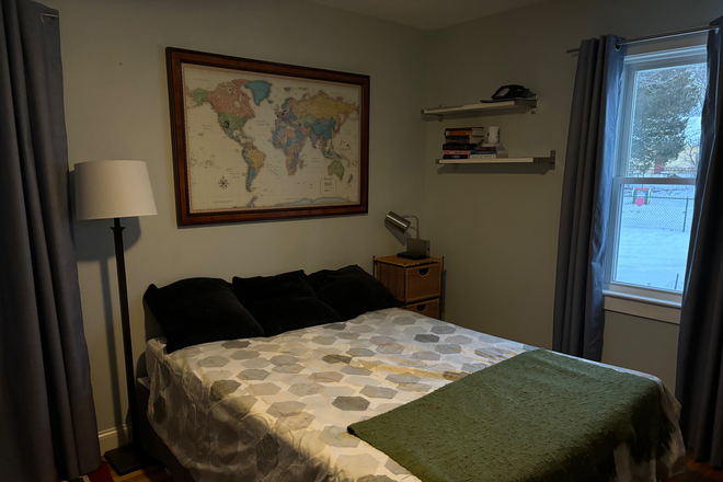 Bedroom , furnished with queen size bed , chair and smart tv - Room for rent in Lawrence Estates with parking and walking distance to Medford Square