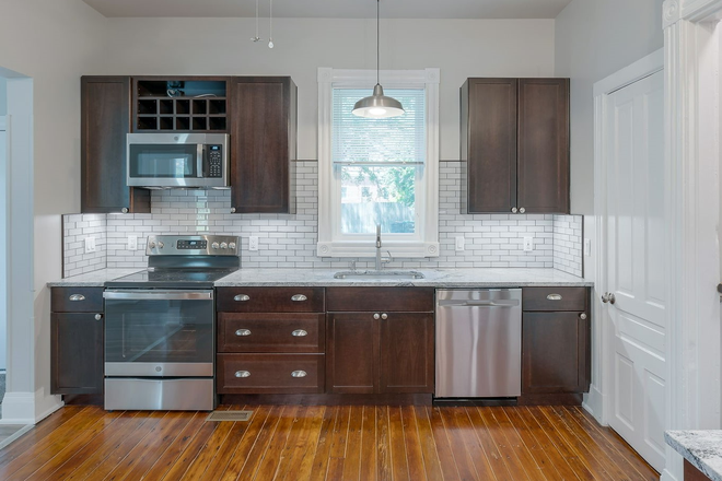 Kitchen Facing Off-Street Parking - 1756 Brewster. Luxury Housing Available JUNE 2026. 5 Off-Street Spaces. Steps to Cream+Sugar Coffee. House