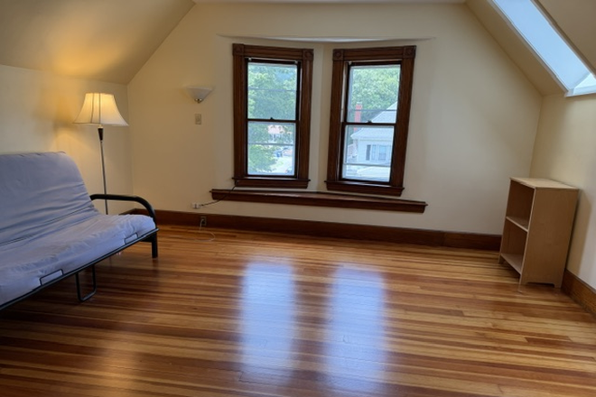 Livingroom is 14 x 14.  The fold-down couch can stay or go as tenant prefers - 26 Morton. 3rd floor walk up,  1 bedroom, walk to campus Triplex