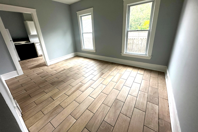 Full dining room with space for a large table and plenty more, plus closet - Huge, sunny, renovated 2BR with laundry and garage Apartments