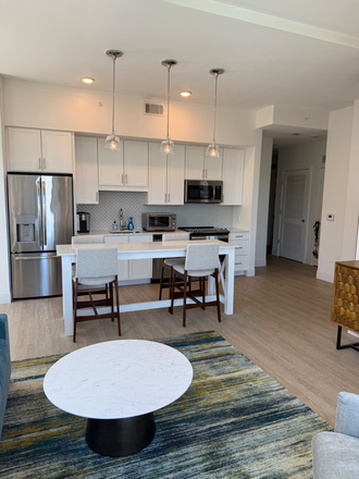 Kitchen/ Living - Downtown Gem!  2 Bed/2 Bath Corner Unit With Pool and River Views at the Jasper! Apartments