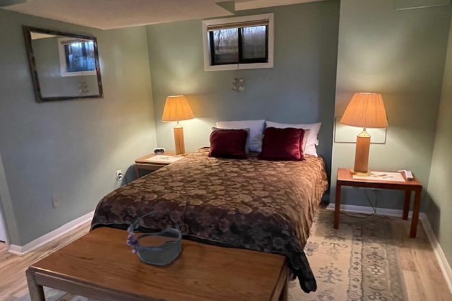 Sleeping area - Large basement studio in quiet private home
