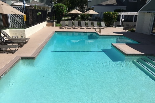Community pool available to you - Bright furnished room for rent and own bathroom.  Female preferred. Across from South Coast Plaza.