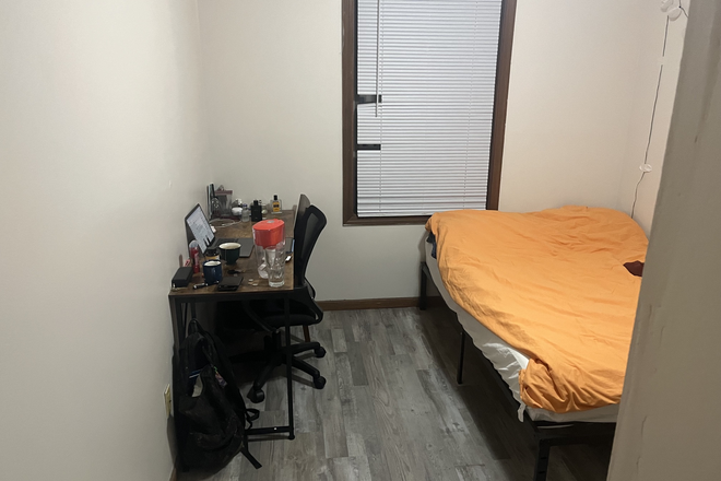 Bedroom located at the front of the hallway located to the right - Bk management apartments