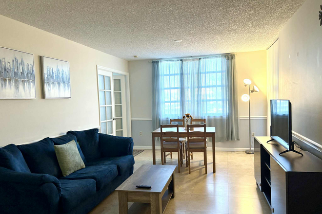 Furnished living room and dining area - Fully Furnished Apartment Walking Distance from UM