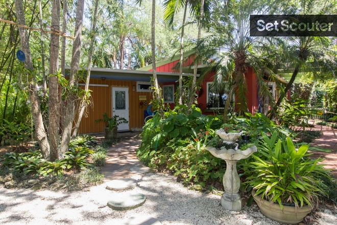 Front of house - AVAILABLE:  Aug. 1, 2026      Beautiful Tropical Efficiency.  Quiet and safe neighborhood.