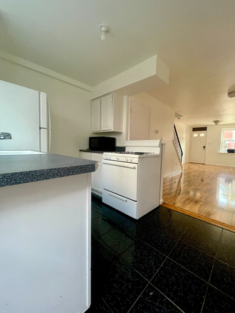 Kitchen - Furnished Townhouse with Hardwood Floors, Washer-Dryer, Central AC, Balcony & Off-Street Parking