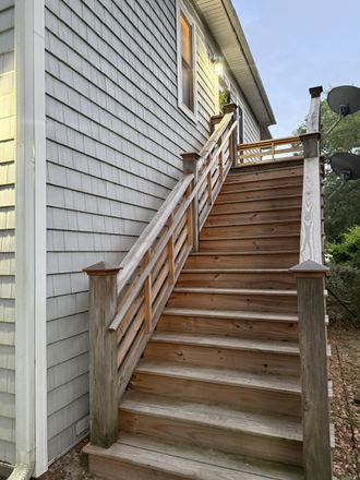Outdoor stairway to apartment - Two-bedroom garage apartment overlooking Clark Sound on James Island. Rent includes all utilities.