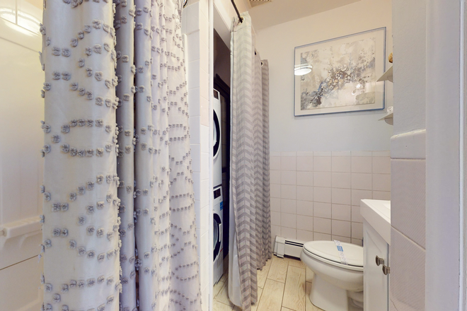 Bathroom w/ Washer/Dryer - STARS Tremont Furnished Apartments