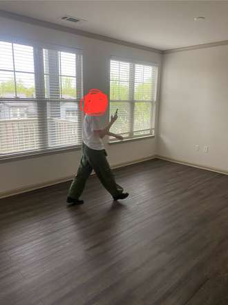 Communal living space (ignore person in photo) - Century New Holland Apartments