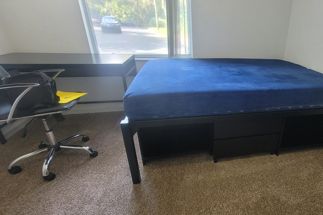 Bedroom Window w/ Bed - The Landings at Bivens Arm Apartments