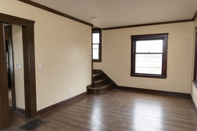 Living Room; Looking towards front entrance and staircase - Charming house in University Circle