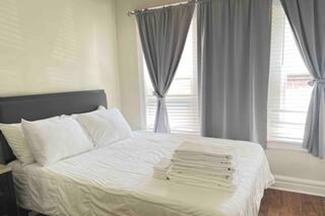 Bed room a windows and hardwood floor - 6136Delmar Blvd 1bedrooms Apartments in Delmar Loop - 0.5 miles from Danforth Campus - Fully Fu